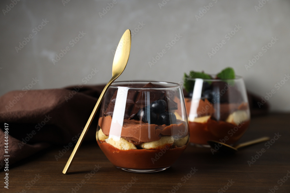 Chocolate mousse in a glass on a dark background.