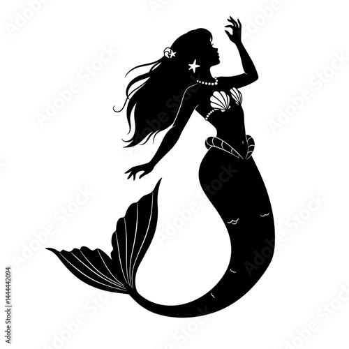 Silhouette of a mermaid gracefully swimming in the ocean  