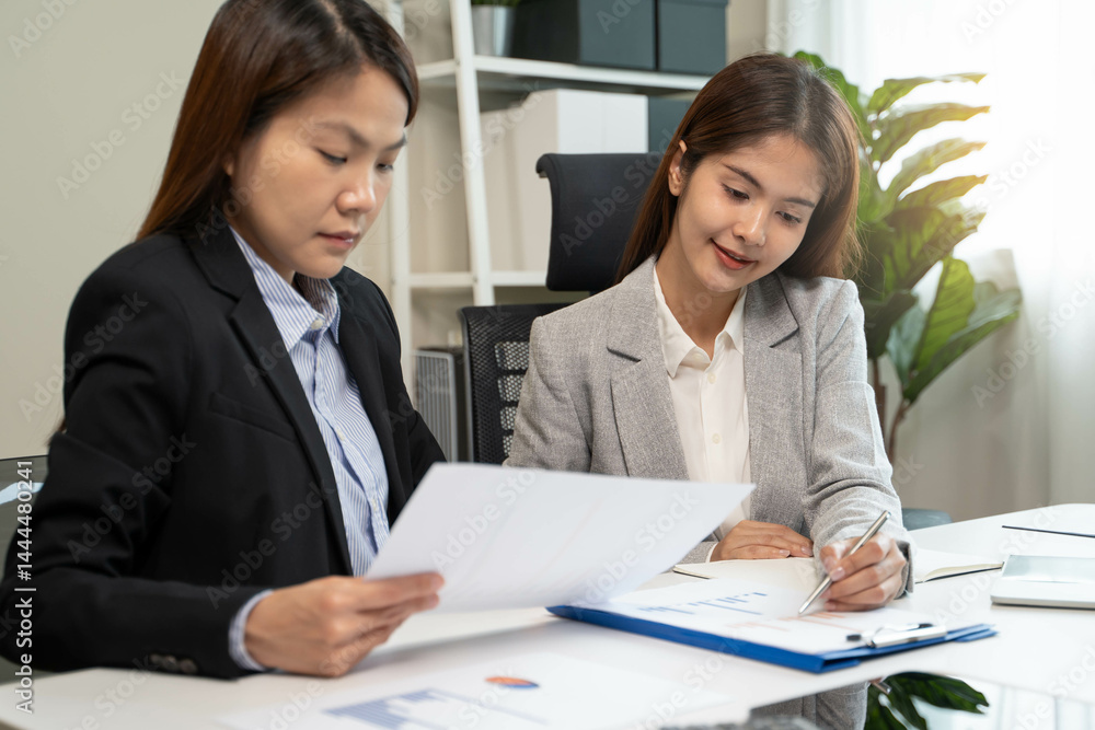 Financial consult planning investor asses and present to client, Close up shot client and advisor review investment strategy in the office. Financial consult planning investor asses and present to client, Close up shot client and advisor review investment strategy in the office.
