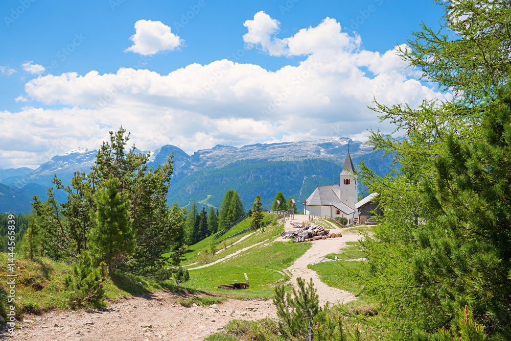 beautiful view from Heiligkreuzkofel mountain trail, to santa croce church. south tyrol landscape Dolomites