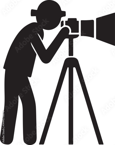 A black silhouette of a professional photographer with a camera on a tripod captures a photograph