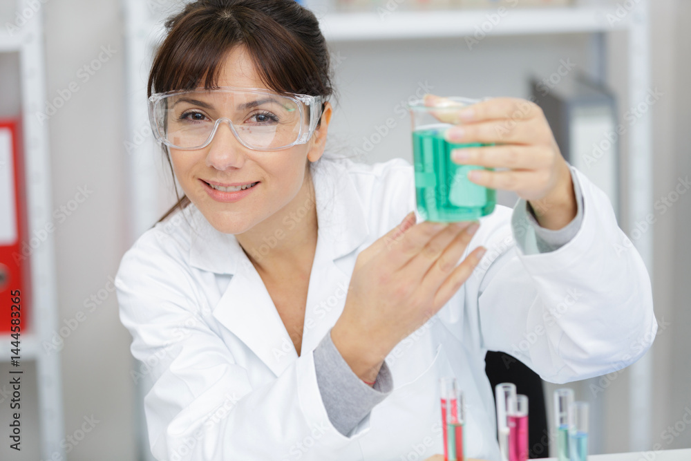 woman working with liquid in her lab woman working with liquid in her lab