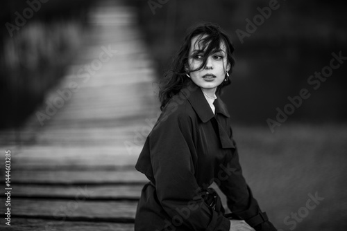 Obraz na płótnie beautiful brunette european girl in blue trench coat at nature. Young lady with beautiful face. w salonie