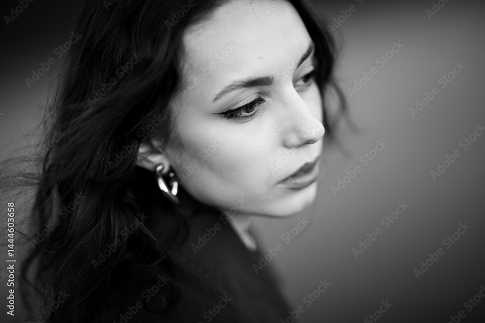 beautiful brunette european girl in blue trench coat at nature. Young lady with beautiful face.