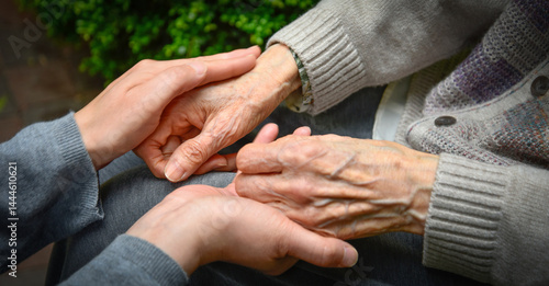 Female carer holding hands of senior man
Photo Formats