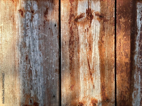 old gray boards with torn off remains of burgundy paint background for your design