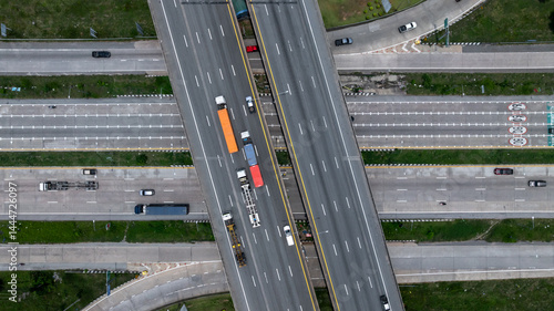 Obraz na płótnie Aerial view highway intersection road, Business logistic transport infrastructure logistic transport, Highway road traffic important infrastructure business logistic import export cargo industry. w salonie