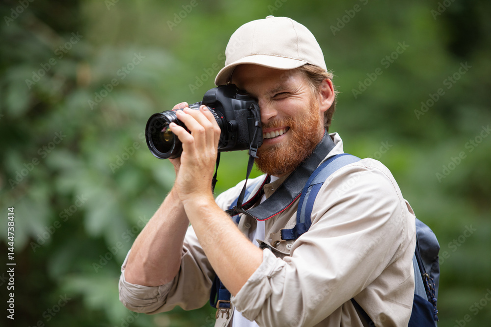 photographer taking pictures in the forest photographer taking pictures in the forest