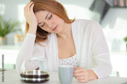 young woman sitting with pain