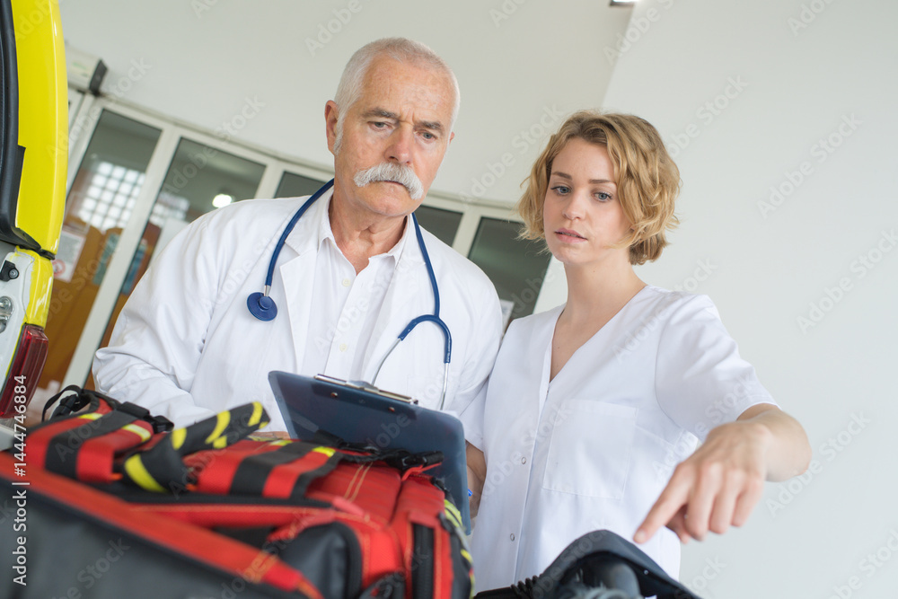 doctors in hospital with ambulance