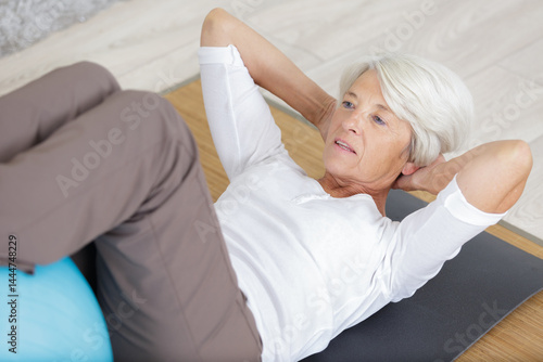 a senior woman doing yoga
