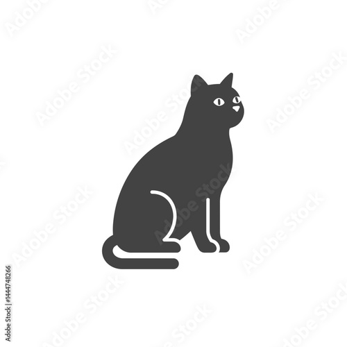Elegant Silhouette of a Cat: A sleek, dark-colored cat sits gracefully, its silhouette perfectly capturing the feline form. An embodiment of feline elegance and domestic companionship.