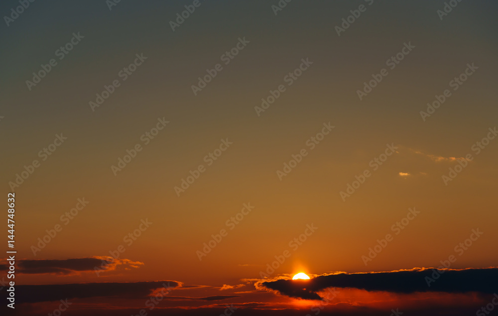 beautiful and dramatic sunset sky with bright yellow clouds as abstract background