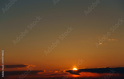 Obraz na płótnie beautiful and dramatic sunset sky with bright yellow clouds as abstract background w salonie