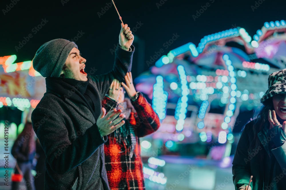 Group of friends having fun at a winter festival, enjoying bright lights and activities. Perfect for themes of togetherness, joy, and celebration.