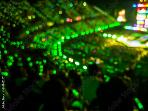 Blurred images of the atmosphere of light, color, sound, and a grand concert performance in a spacious hall.