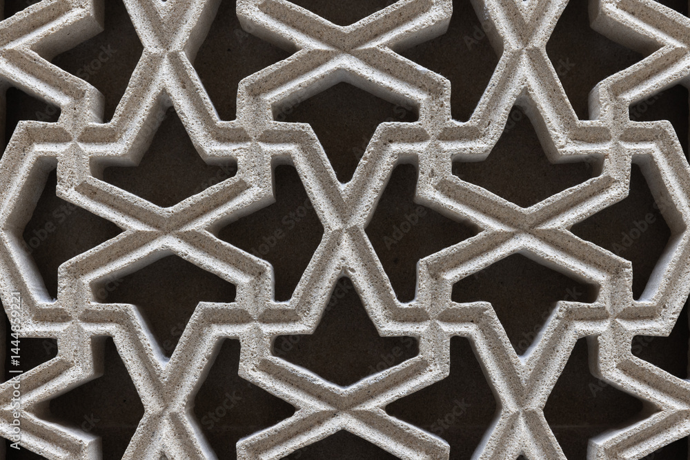 Intricate Arabic geometric pattern featuring interconnected symmetries