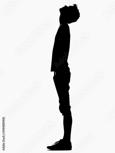 Man is standing tall and looking up. The image is in black and white and the man is the only visible object. Scene is somber and contemplative