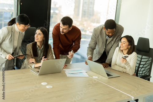 Collaboration thrives in a modern office with stylish professionals engaged in discussion