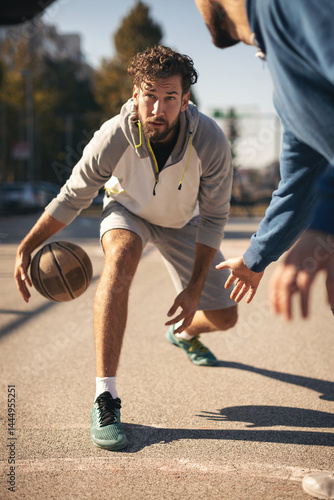 Group of friends playing basketball outdoors.