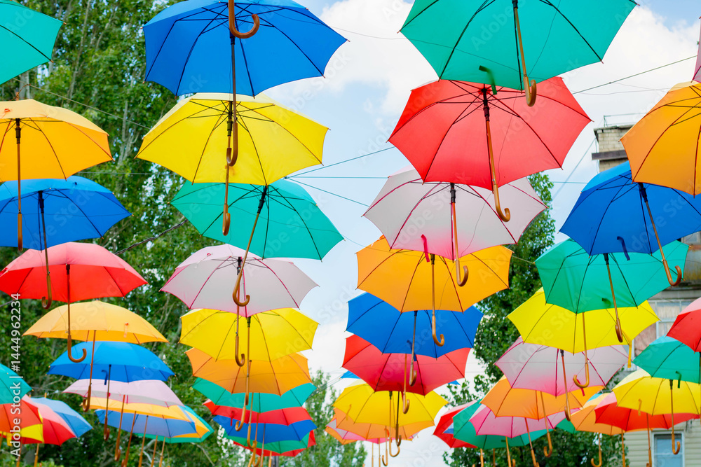 Bright colorful umbrellas under the sky, city decoration