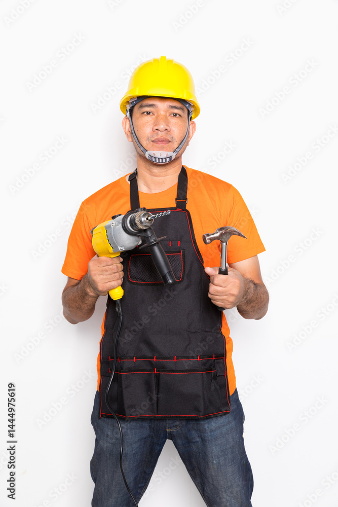 Portrait worker in black uniform with electric drill and hammer isolated on white background Portrait worker in black uniform with electric drill and hammer isolated on white background
