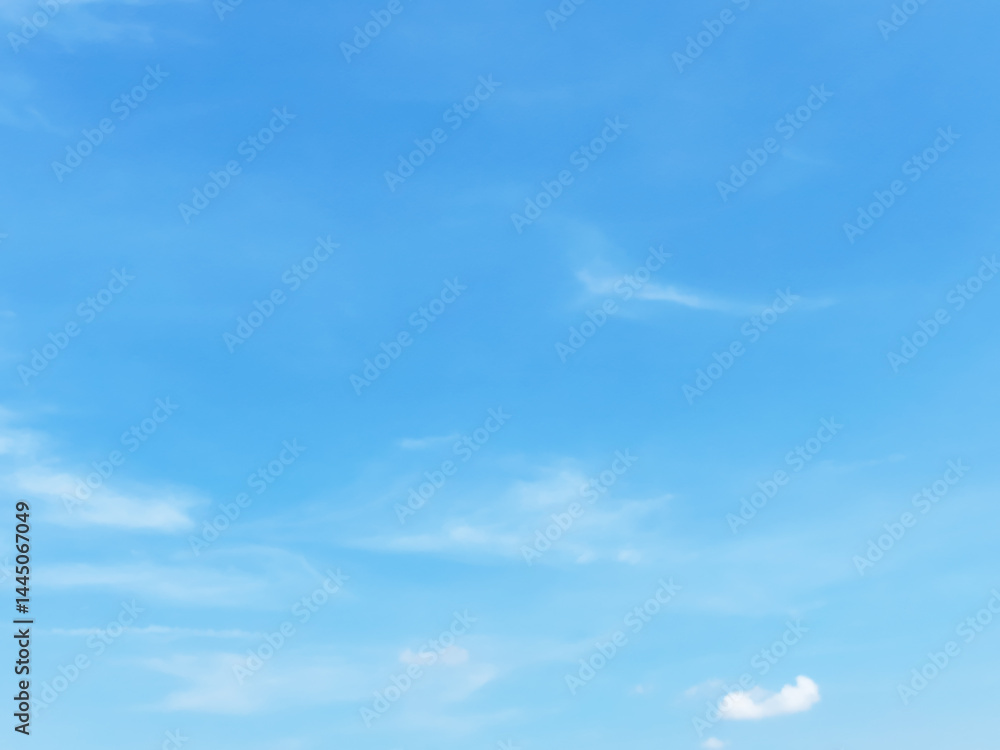 Blue sky background and white clouds soft focus, and empty space, horizontal shape.