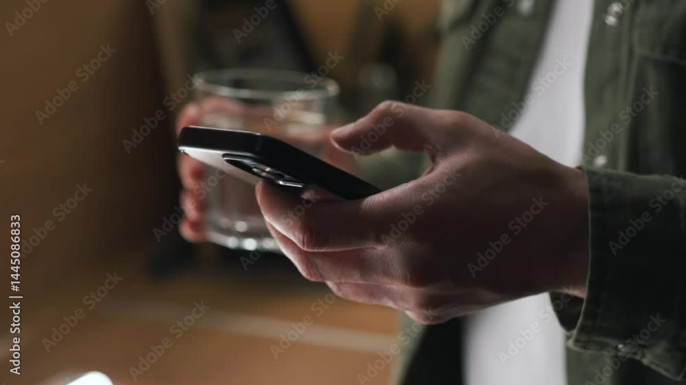 A man swiping on a phone screen.
A man with a phone in an office.
A business man in a green shirt with a mobile phone in his hands.
A modern phone in a guy's hands A man swiping on a phone screen.
A man with a phone in an office.
A business man in a green shirt with a mobile phone in his hands.
A modern phone in a guy's hands