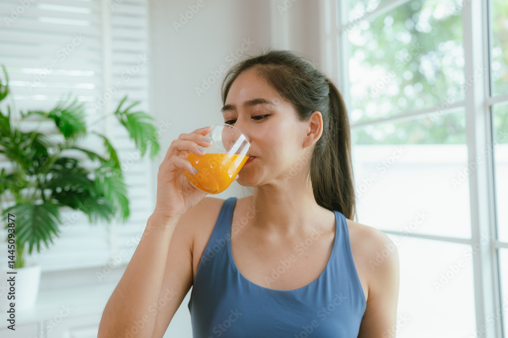 Young Asian woman in bright kitchen. Healthy colorful with fresh fruits and vegetables. Enjoying the vibrant lifestyle. Young Asian woman in bright kitchen. Healthy colorful with fresh fruits and vegetables. Enjoying the vibrant lifestyle.