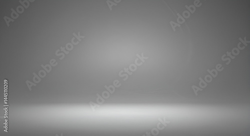 Empty, gray studio backdrop with soft lighting
