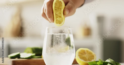 Squeezing lemon into drinking water