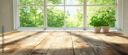 Wooden table with vibrant green plant pots near bright window showcasing lush trees in the background