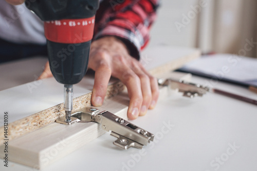 Young man making his own furniture