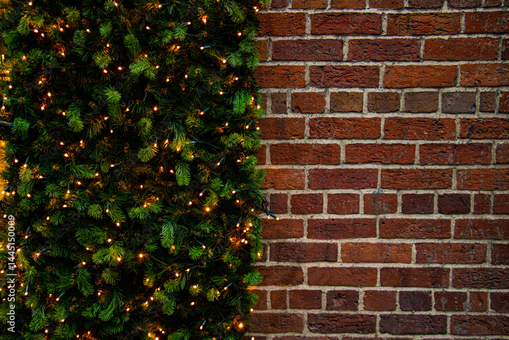 Rustic brick wall background with a Christmas garland and copy space image
