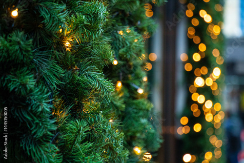 Obraz na płótnie Christmas tree with luminous garland, with focus in the foreground and a blurred backdrop w salonie