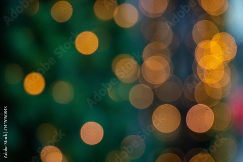Obraz na płótnie Christmas garland warm lights bokeh on green background w salonie