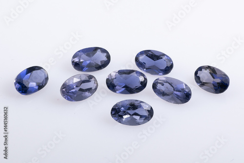 Obraz na płótnie Set of Eight Polished Oval Sapphire Gemstones on a White Background w salonie