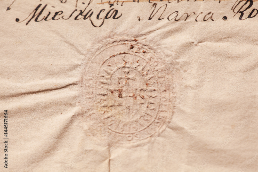Obraz premium Detailed shot highlighting the embossed design and aged texture of a historical document authenticated with a dry seal.