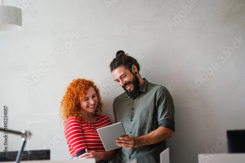 Software, coding and business woman on tablet thinking of data analytics, digital technology.