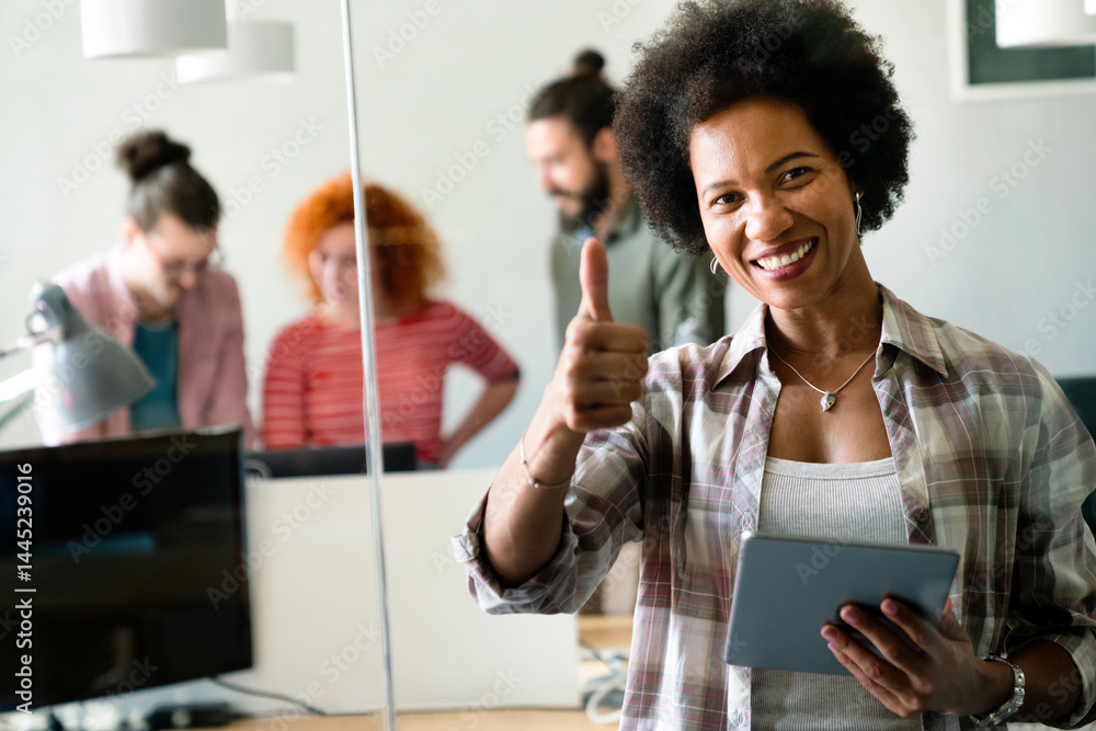 Portrait of happy success black woman working in a busy modern workplace, Startup coworker concept