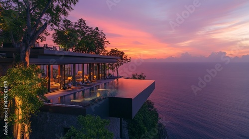 Stunning sunset over modern oceanfront villa bali luxury architecture serene environment elevated viewpoint relaxation concept