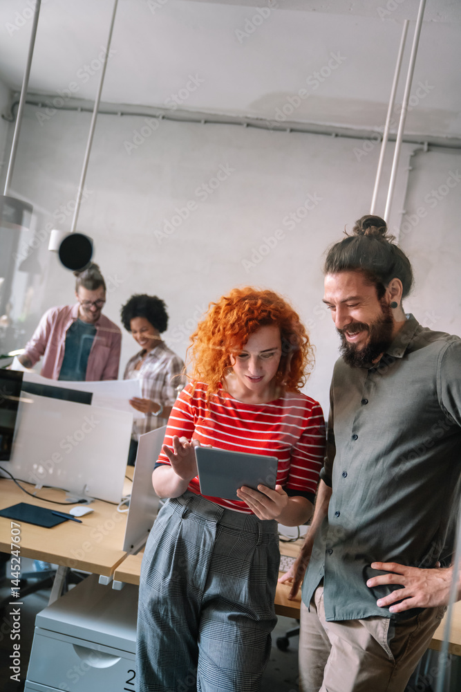 Group of business people and software developers working as a team in office