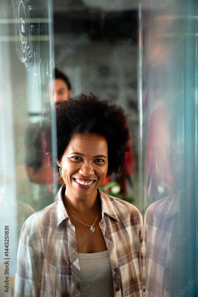 Portrait of african american female IT developer, programmer, designer working with programming code