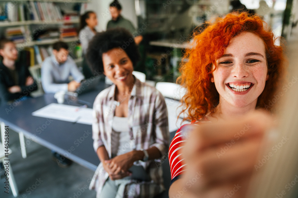 Portrait of young happy success woman working in a busy modern workplace, Startup coworker concept