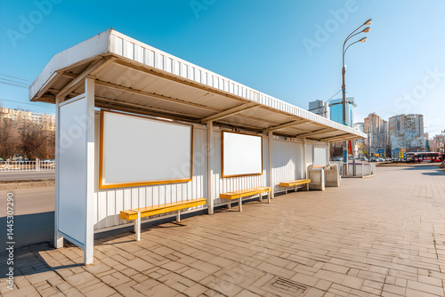 Fototapeta Naklejka Na Ścianę i Meble -  Empty bus stop with a modern design, sunlit urban environment, ideal for ads or travel-related content, clean minimalism.
