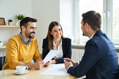 Smiling couple professional meeting financial advisor reviewing documents at table in office