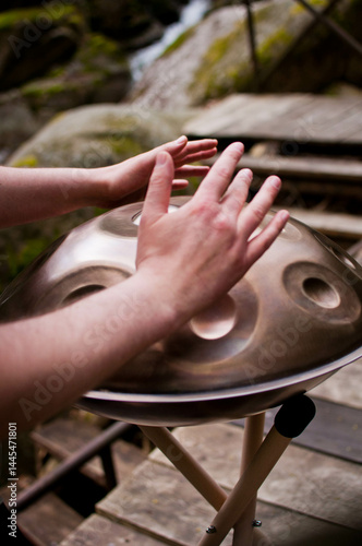 handpan outdoors near a waterfall