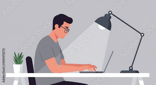 Focused Man Working on Laptop at Night, Illuminated by Desk Lamp