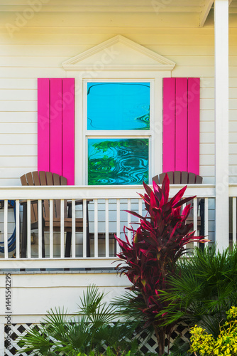 Obraz na płótnie Window of a wooden house with pink shutters, colorful architecture in Bahama village, Key West, Florida w salonie