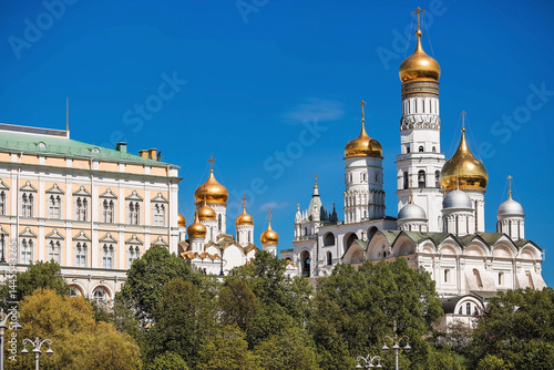 Moscow on a sunny day. The Grand Kremlin Palace, the Annunciation Cathedral, the Archangel Cathedral and the bell tower of Ivan the Great on the Kremlin embankment. The business card of Moscow.